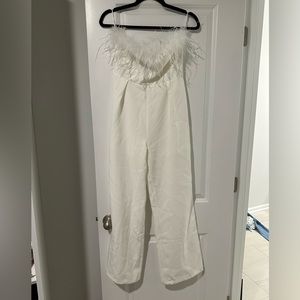 Altard State strapless white jumpsuit with feathers.